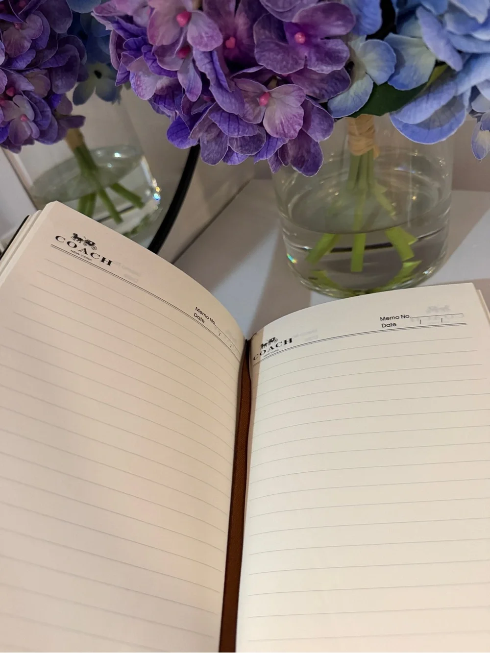COACH Brown Signature Leather Notebook - COACH New York with a Pen